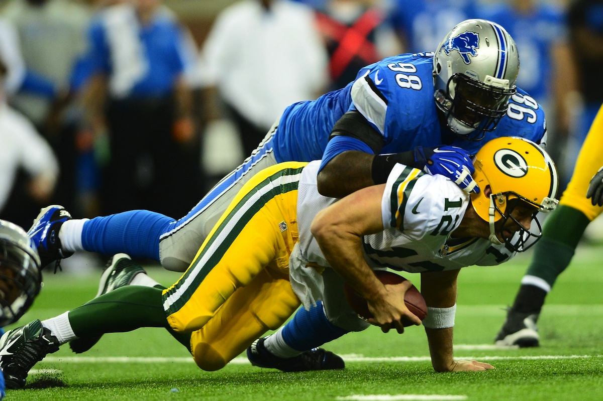 Packers quarterback Aaron Rodgers is sacked by Lions defensive lineman Nick Fairley. Andrew Weber—USA TODAY Sports.