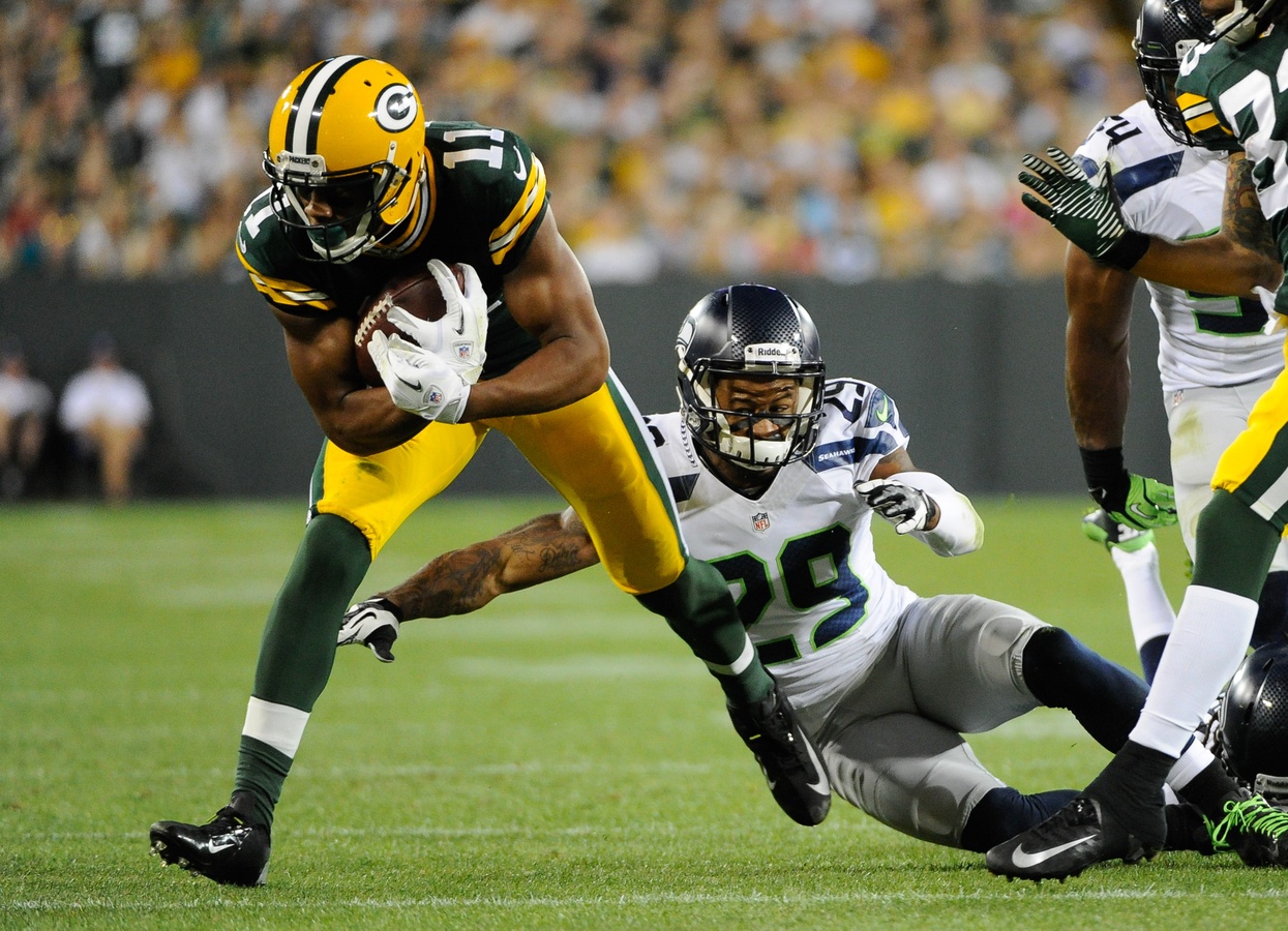 Packers wide receiver Jarrett Boykin runs away from Seahawks safety Earl Thomas by Benny Sieu—USA TODAY Sports.