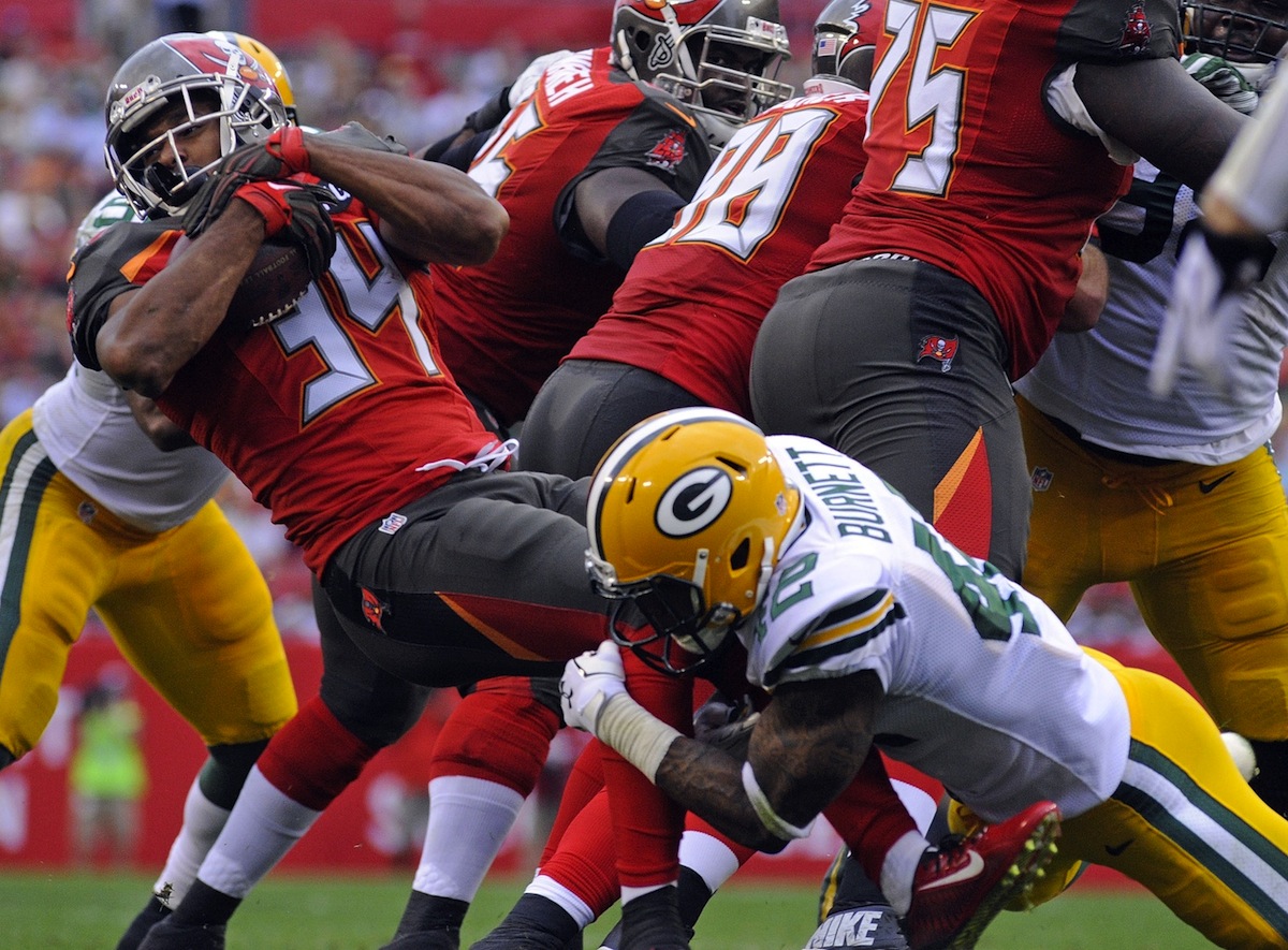 Packers safety Morgan Burnett tackles Buccaneers running back Charles Sims by David Manning—USA TODAY Sports.