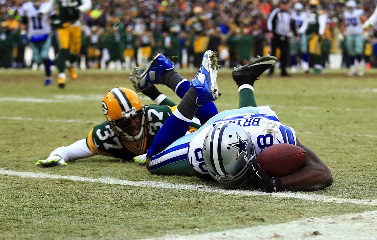 Cowboys wide receiver Dez Bryant grasps at the football in vain by Andrew Weber—USA TODAY Sports.