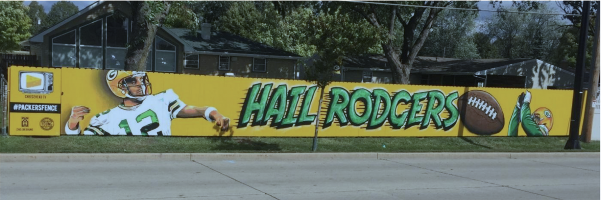 Mr. Young painted Aaron Rodgers and the Receiver while Mr. Statz did the “Hail Rodgers,” football, CheeseheadTV   logo,   and   stencil   work