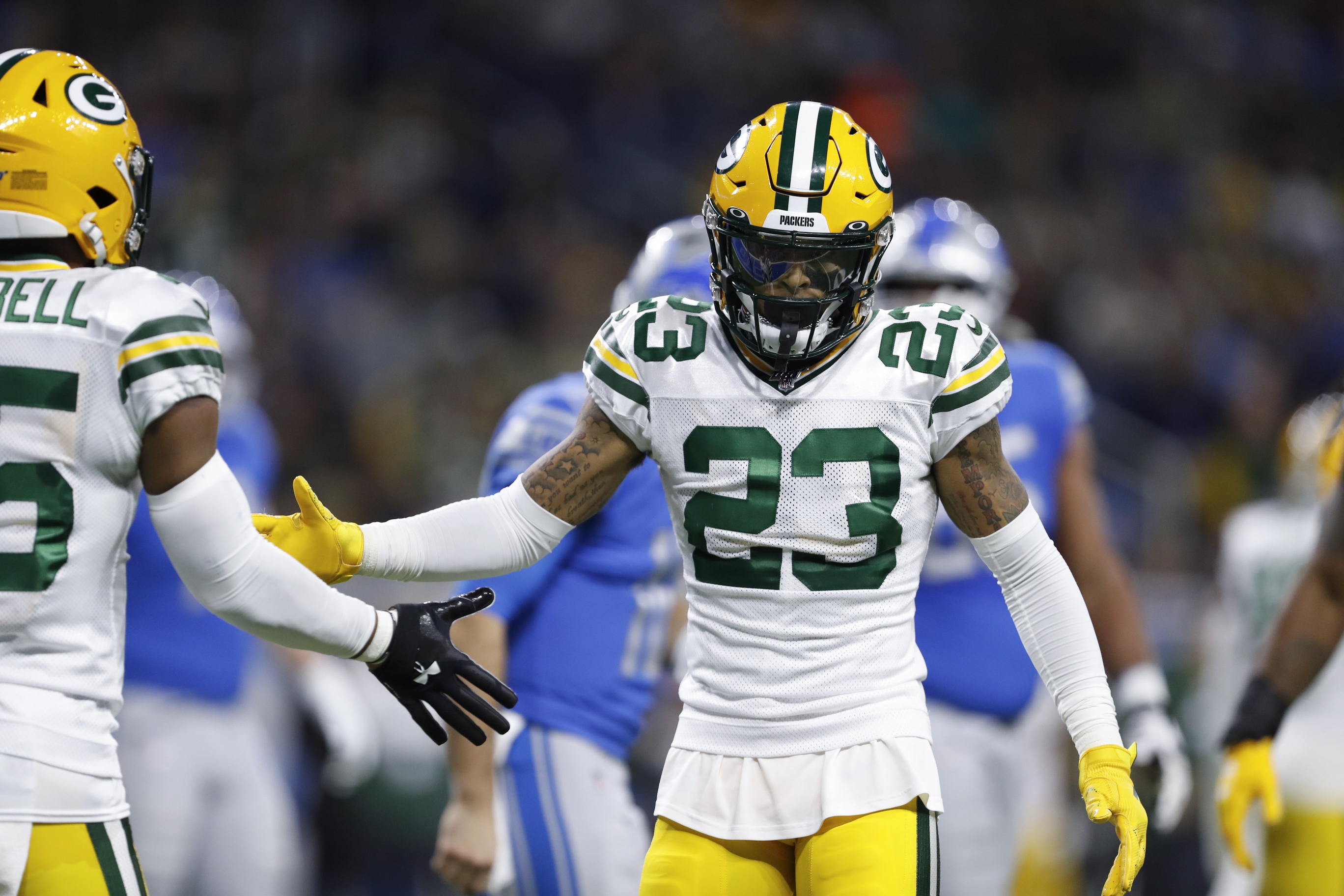 Green Bay Packers' Jaire Alexander intercepts a pass in front of