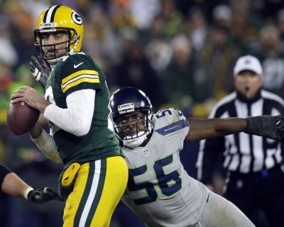 Aaron Rodgers Refuses to cool down Against top-ranked Seattle Defense